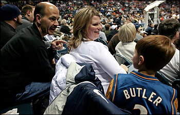 Policeman Richard Geller watches a Wizards game with wife, Heidi, and son, Sawyer. Geller could have arrested Butler in '98, but chose not to. "[God] said 'I'm going to touch you so that you can touch others.' " Butler recalled.