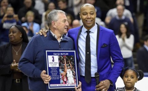 Former head coach Jim Calhoun congratulates Caron Butler after Butler was honored by having his name placed up on the Huskies Wall of Honor at halftime during the Huskies game against Tulsa at Gample Pavilion Saturday night. (John Woike / Hartford Courant)